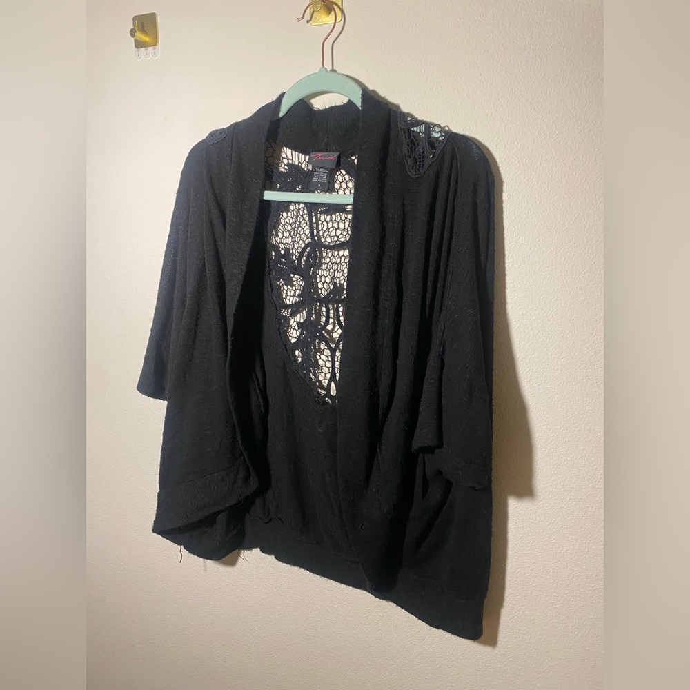 Used beautiful 3/4 sleeve cardigan in color black. Beautiful back detail.